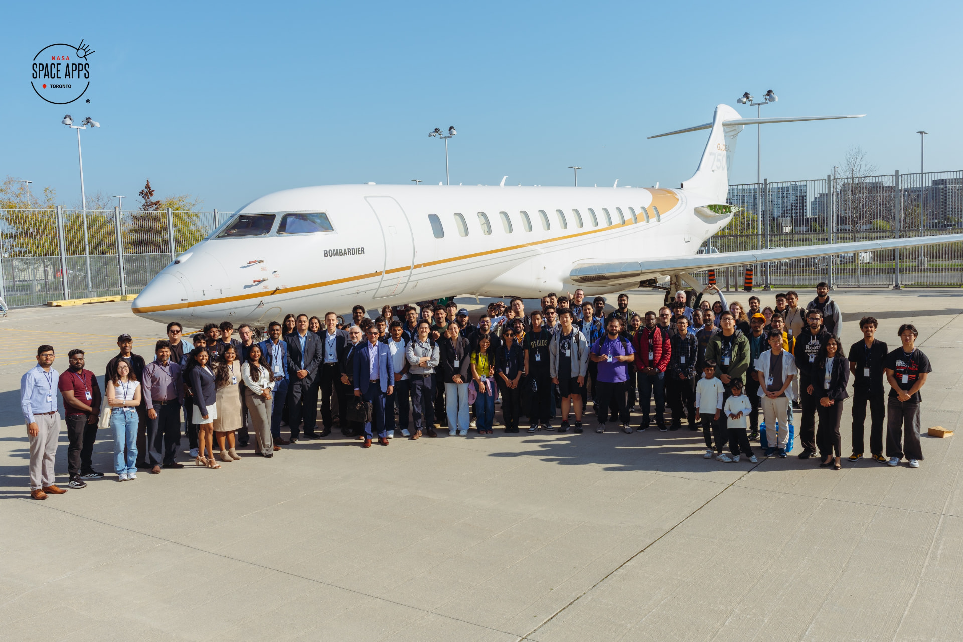 NASA Space Apps Toronto 2025 participants outside the Bombardier aircraft